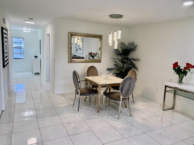 dining room featuring light tile floors