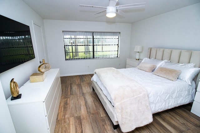 bedroom with ceiling fan and dark hardwood / wood-style flooring