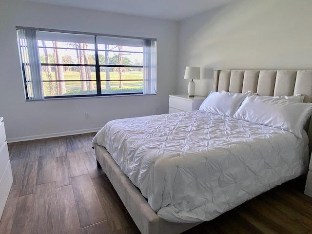 bedroom featuring dark hardwood / wood-style flooring