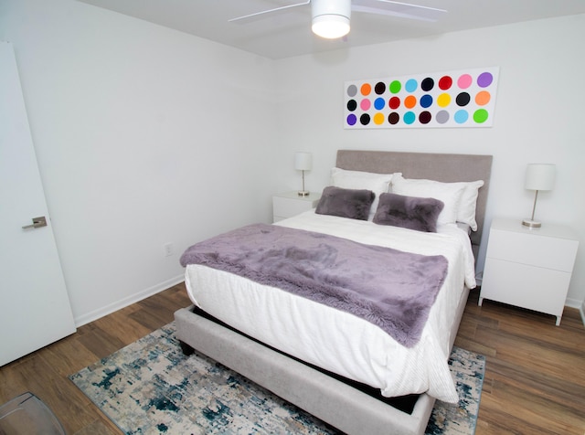 bedroom with ceiling fan and dark wood-type flooring