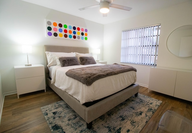 bedroom featuring ceiling fan and dark wood-type flooring