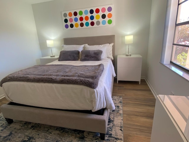 bedroom featuring dark hardwood / wood-style floors