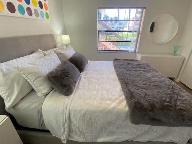 bedroom with wood-type flooring