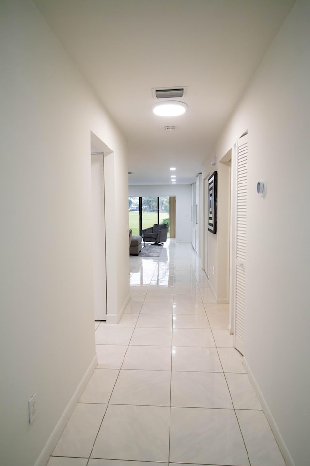 hall with light tile floors