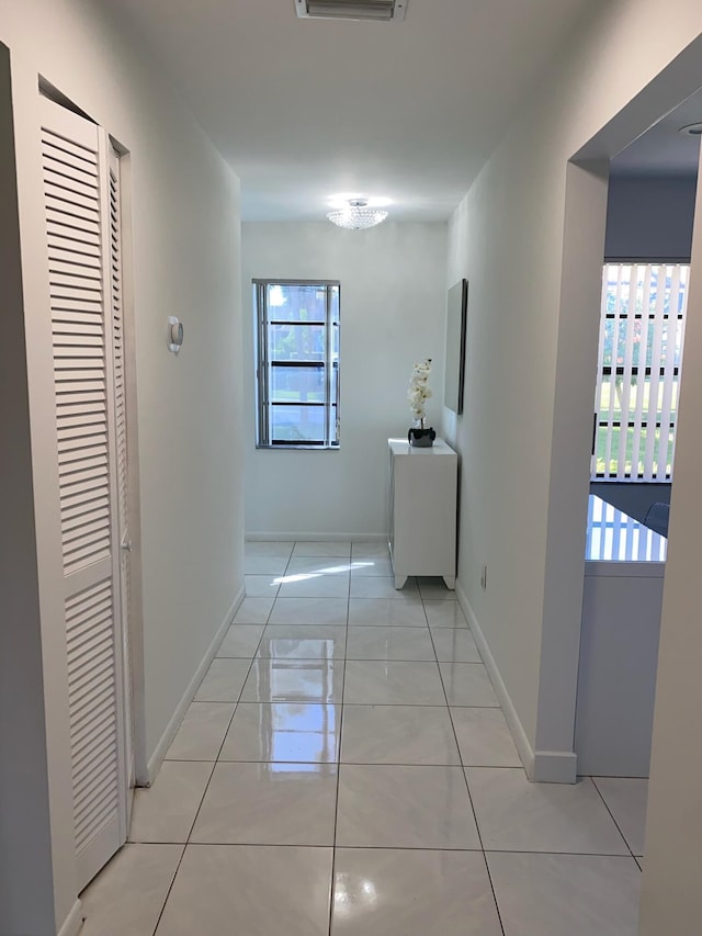 corridor with light tile flooring