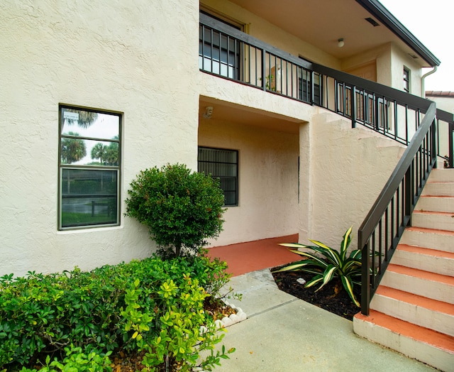 entrance to property with a balcony