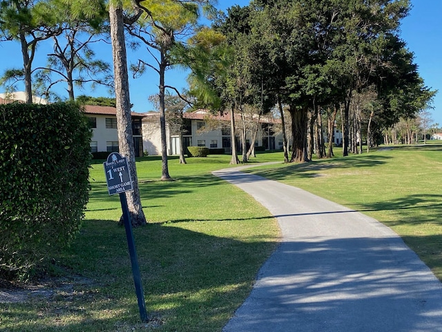 view of home's community featuring a lawn