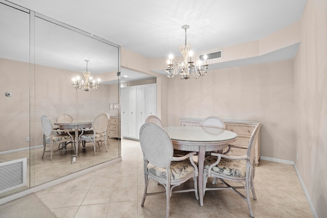 tiled dining area with an inviting chandelier