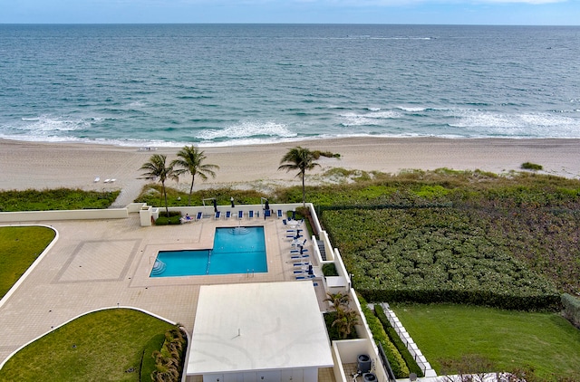 view of swimming pool with a beach view, a water view, central air condition unit, and a patio area