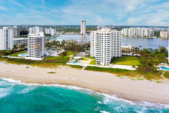 bird's eye view featuring a beach view and a water view