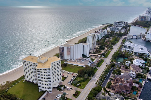 birds eye view of property featuring a water view and a view of the beach