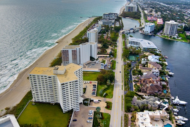 birds eye view of property featuring a view of the beach and a water view