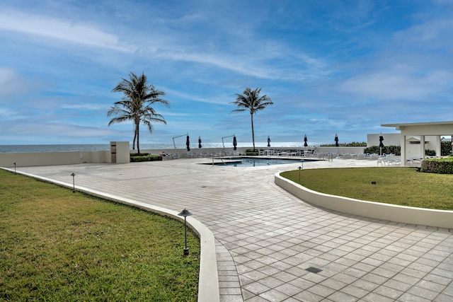 view of home's community with a swimming pool and a yard