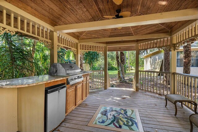 living room featuring ceiling fan, light hardwood / wood-style floors, and high vaulted ceiling