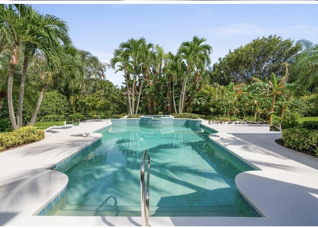 view of pool featuring a pool with connected hot tub