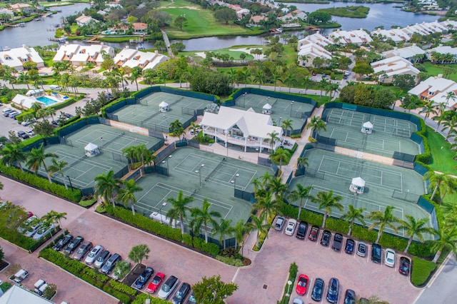 drone / aerial view with a residential view and a water view