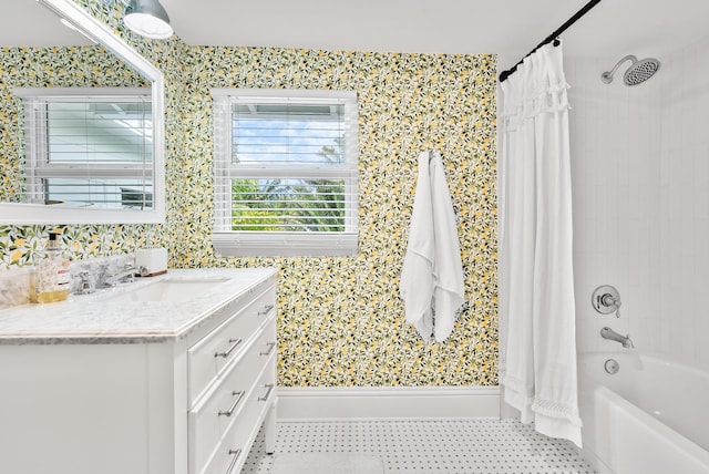 bathroom featuring vanity and shower / bathtub combination with curtain