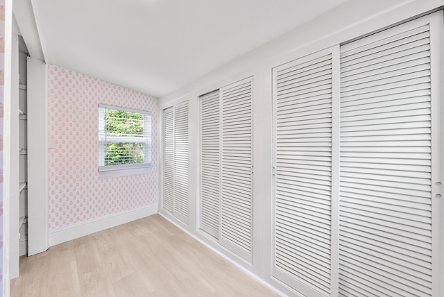 unfurnished bedroom featuring light wood-type flooring