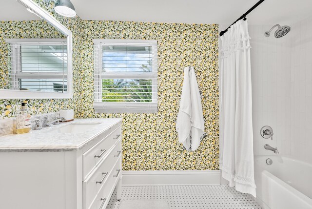 bathroom featuring tile patterned flooring, vanity, and shower / bathtub combination with curtain