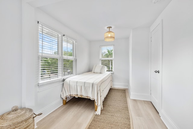 bedroom with light wood-type flooring