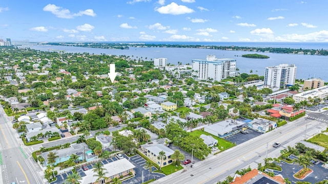 birds eye view of property with a water view