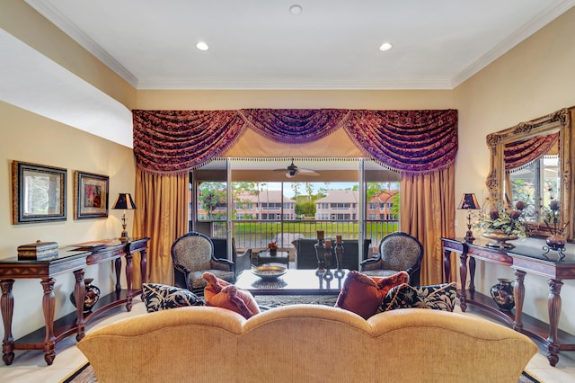 living room featuring ornamental molding, ceiling fan, and a wealth of natural light