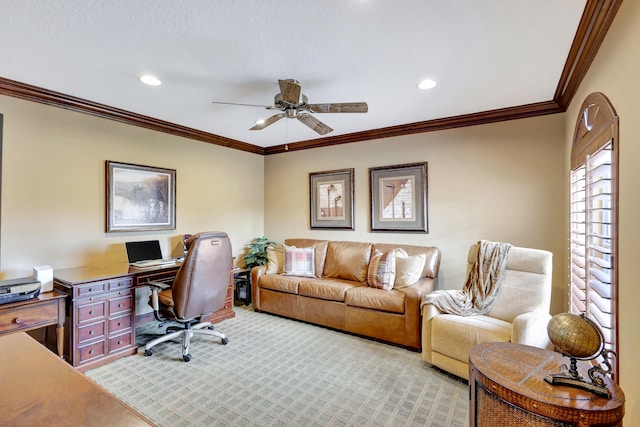 office space with light colored carpet, ceiling fan, and crown molding