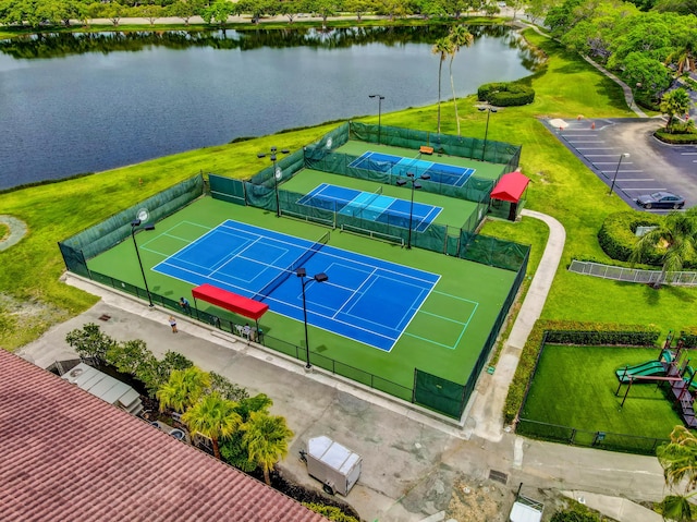 birds eye view of property with a water view