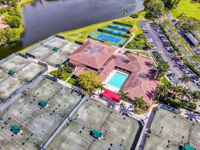 birds eye view of property with a water view