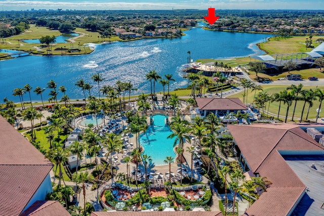 birds eye view of property with a water view