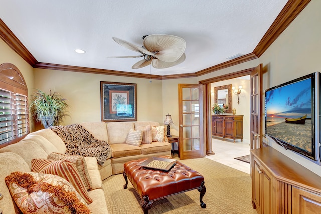 living room with french doors, ornamental molding, light tile flooring, and ceiling fan