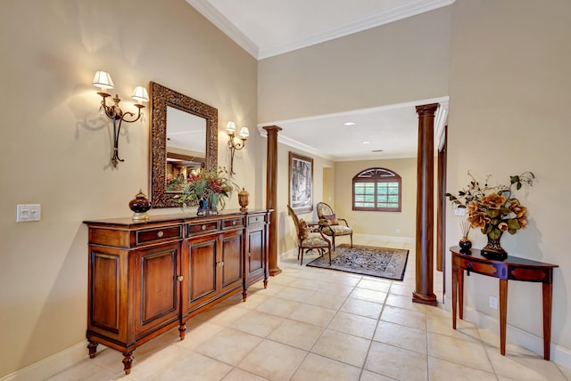 hall featuring decorative columns, light tile floors, and crown molding