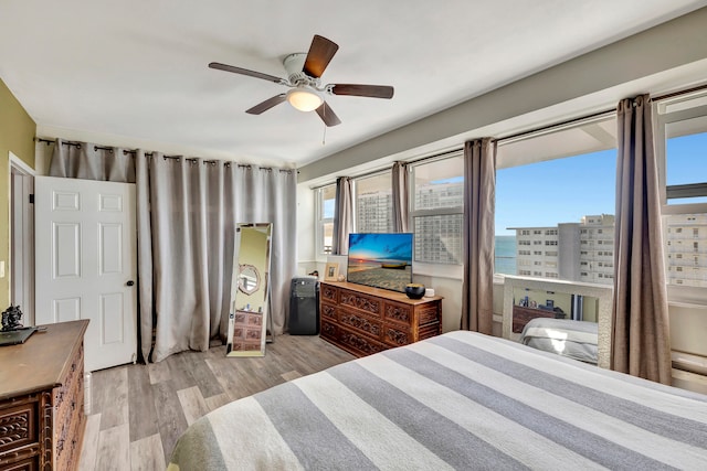 bedroom featuring a ceiling fan and wood finished floors