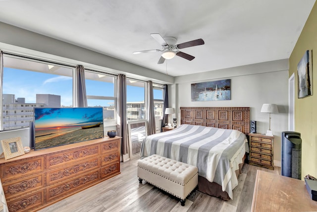 bedroom featuring a ceiling fan and wood finished floors