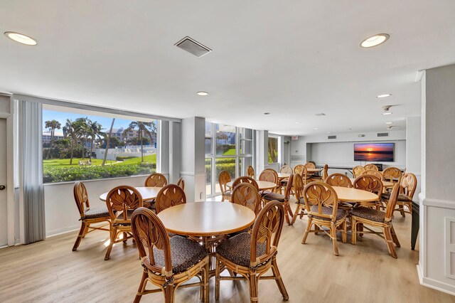 dining space featuring recessed lighting and light wood-style flooring