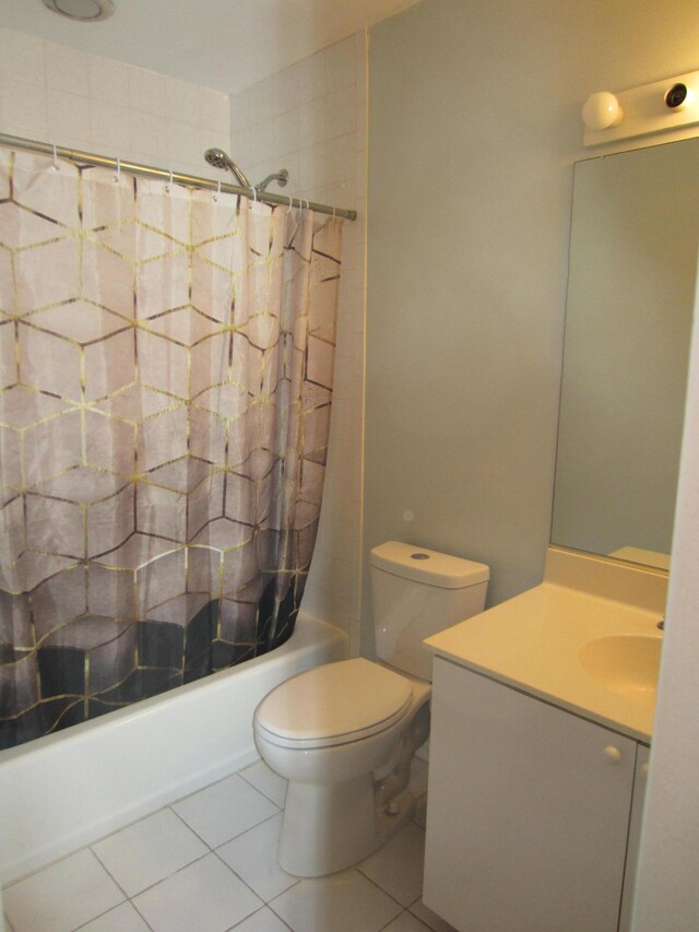 full bathroom with toilet, shower / bath combo with shower curtain, vanity, and tile flooring