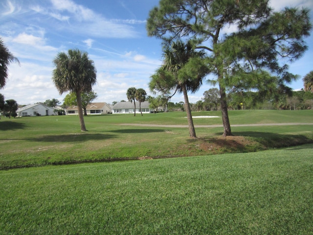 view of home's community featuring a lawn