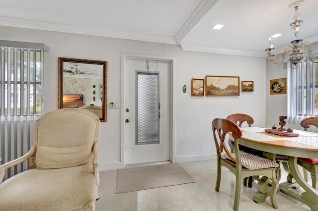 dining space featuring ornamental molding and light tile flooring