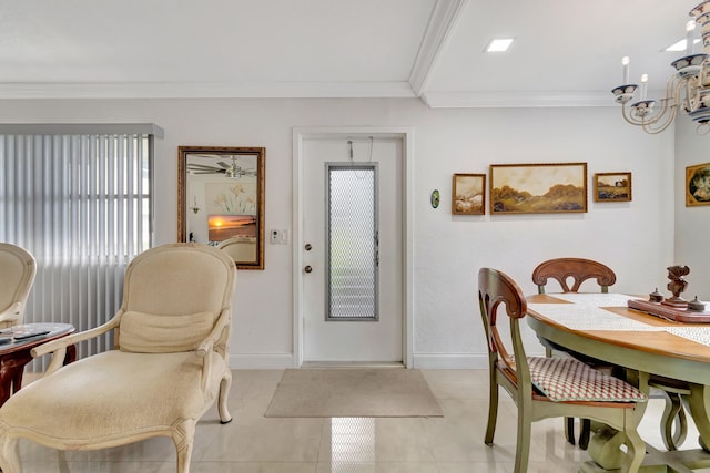 dining space with crown molding, a notable chandelier, and light tile floors