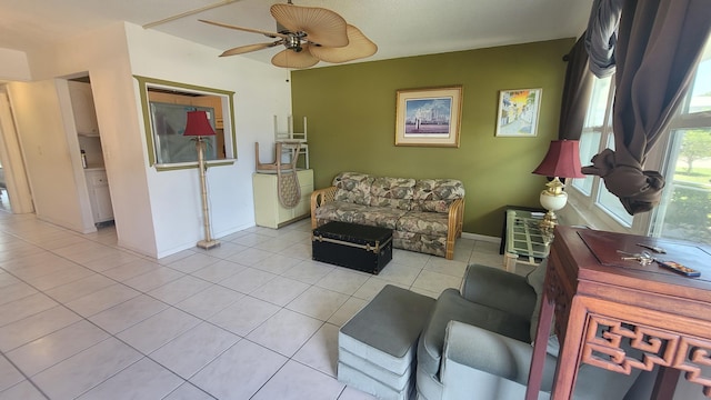 living room with ceiling fan and light tile floors