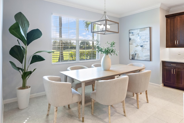 dining area with a chandelier and ornamental molding