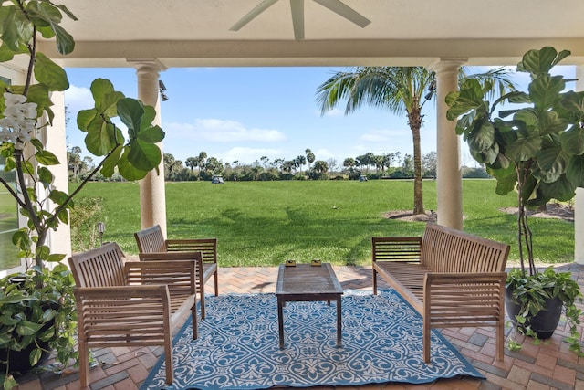 view of patio with ceiling fan and an outdoor living space