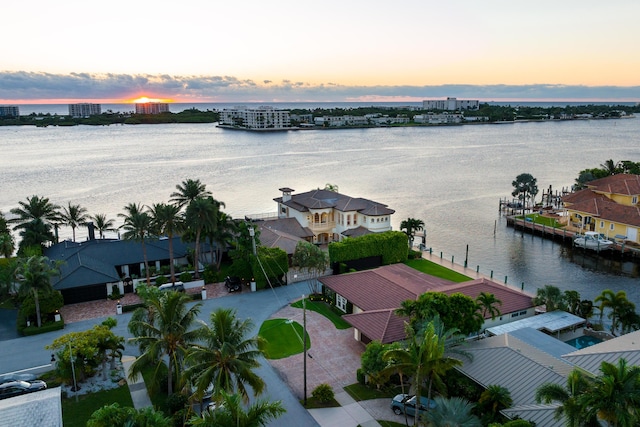 aerial view at dusk with a water view