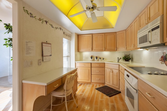 kitchen with white appliances, ceiling fan, tasteful backsplash, light brown cabinets, and light wood-type flooring