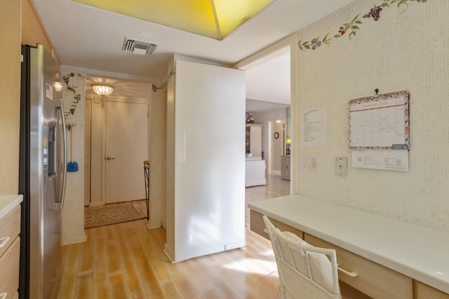 hall with light hardwood / wood-style floors