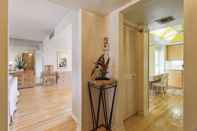 corridor featuring light hardwood / wood-style flooring