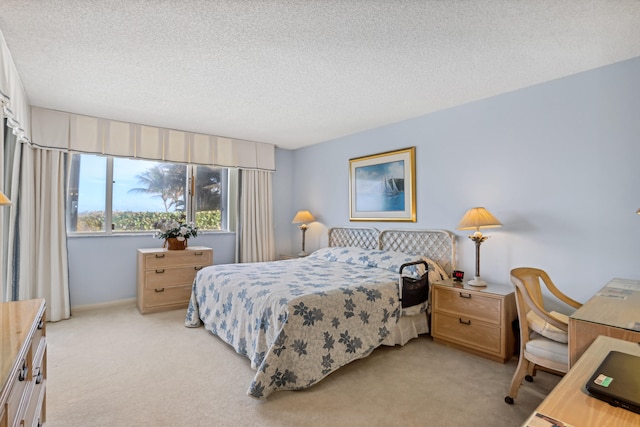 carpeted bedroom featuring a textured ceiling