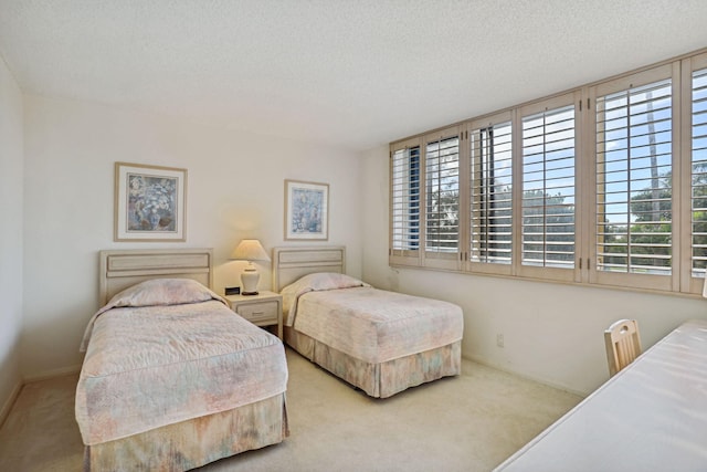 carpeted bedroom with a textured ceiling