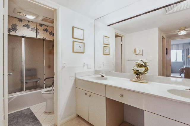 full bathroom with shower / bath combination with glass door, toilet, dual bowl vanity, and tile flooring