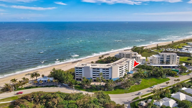 birds eye view of property featuring a water view and a view of the beach